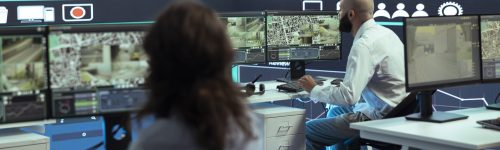 Diverse employees giving gps coordinates to couriers via satellite navigation