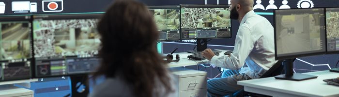 Diverse employees giving gps coordinates to couriers via satellite navigation