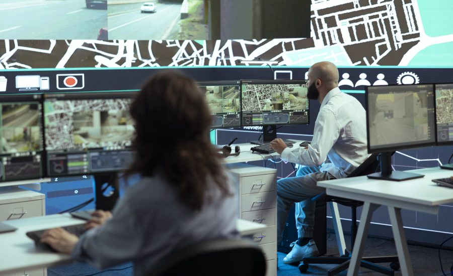 Diverse employees giving gps coordinates to couriers via satellite navigation
